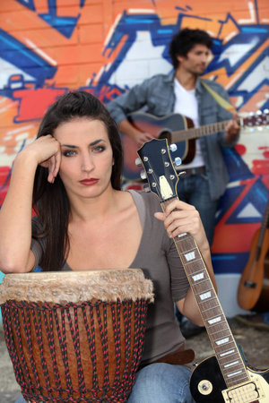 Couple playing musical instrumentsの写真素材