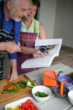 Couple cooking togetherの写真素材