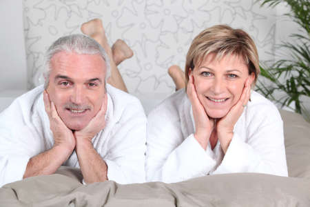 Couple lying in bedの写真素材