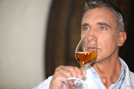 wine expert tasting a vintageの写真素材