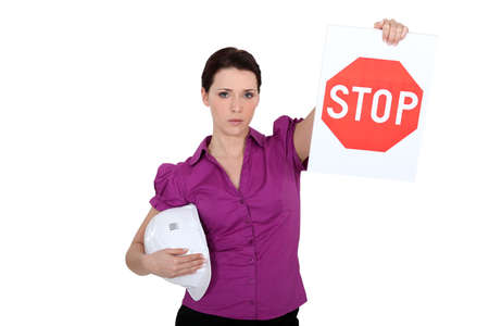 a construction manager showing a stop panelの写真素材