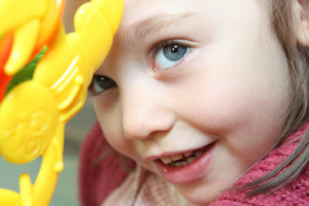 Little girl playing with a toyの写真素材