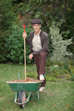 Gardener with a wheelbarrowの写真素材