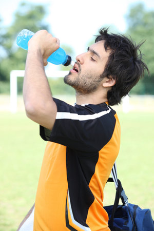 Footballer drinking water