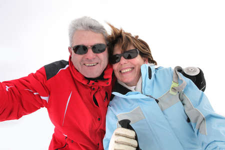 Couple on snowy mountainの写真素材