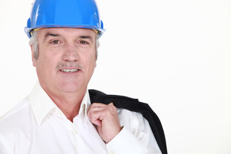 senior businessman wearing helmet and smiling