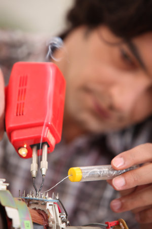 Man using soldering iron