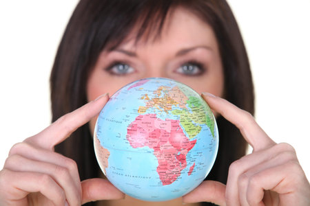 Woman showing a globe