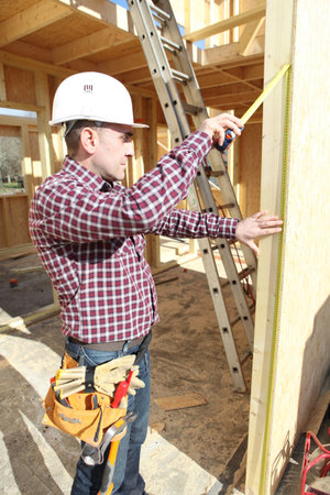 Carpenter working on house