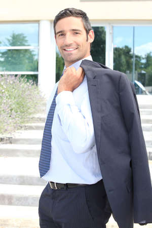 Businessman leaving officeの写真素材