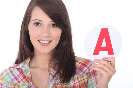 Young women holding learner plate