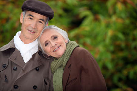 A mature couple in a park.の写真素材