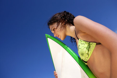 Woman with surfboard