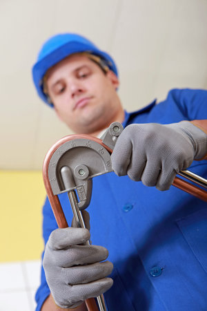 craftsman bending a pipe