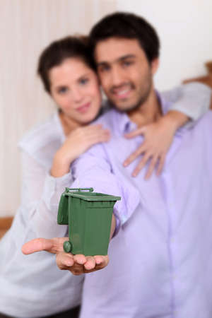 Couple holding miniature binの写真素材