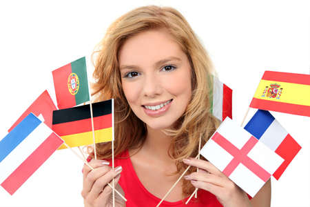 girl holding a bunch of national flags girl holding a bunch of national flags