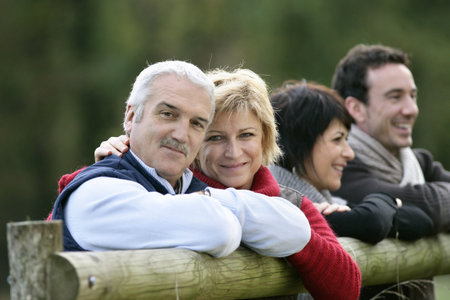two couples in the countrysideの写真素材