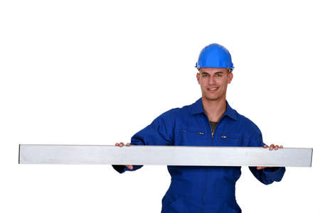 Construction worker stood with metal beanの写真素材