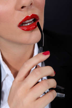 Sexy woman with red glossy lipstickの写真素材