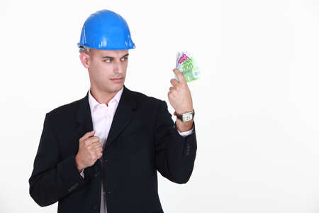 foreman with bank notes in handの写真素材