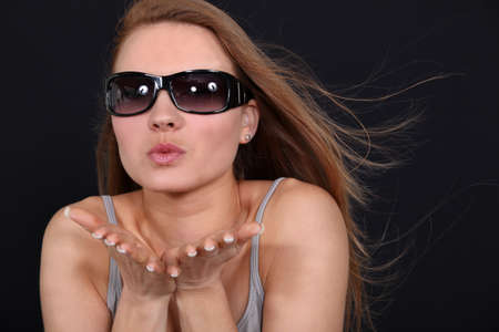 Woman blowing a kissの写真素材