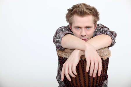 Man with a djembe drumの写真素材