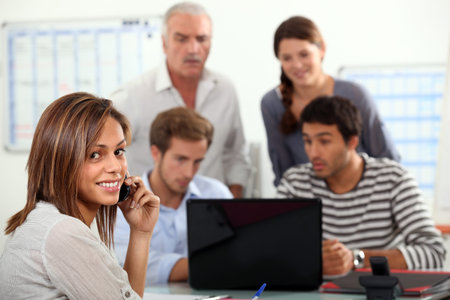 woman advising a group  of people possibly a family