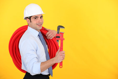 Happy entrepreneur on yellow background