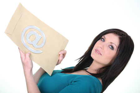 Woman holding an envelope with an at sign on it