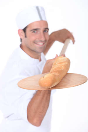baker baking breadの写真素材