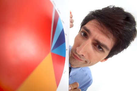 A close-up of a businessman and a pie chart 