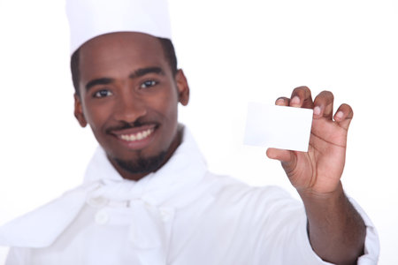 Chef holding business cardの写真素材