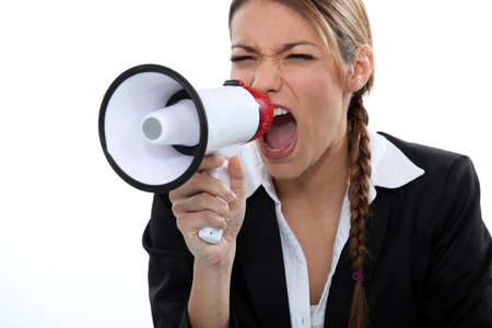 Woman shouting through a loudspeakerの写真素材