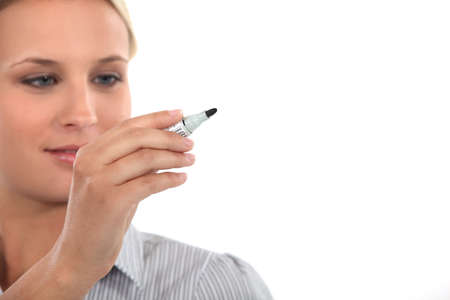 Woman holding a markerの写真素材
