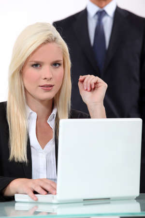 Blonde woman and man in the backgroundの写真素材