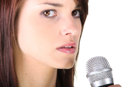 Brunette stood holding microphone
