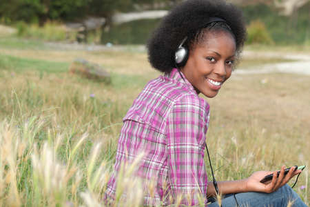 young woman listening to musicの写真素材