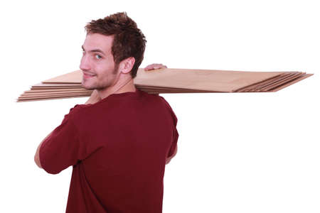 Man carrying parquet slatsの写真素材