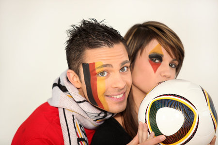 German couple supporting their national football teamの写真素材