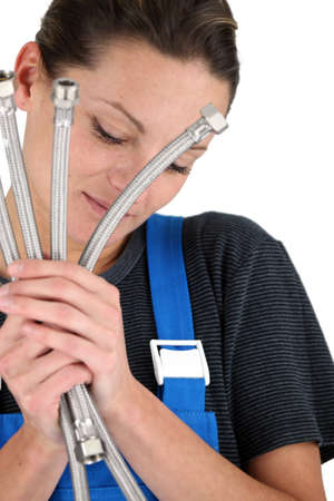 Plumber holding tubesの写真素材