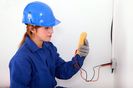 Woman taking electrical reading