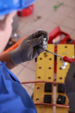 Electrician preparing bracket