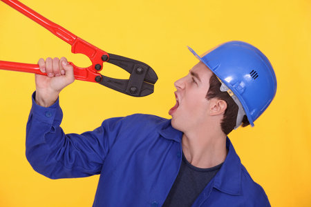 Man holding bolt cuttersの写真素材