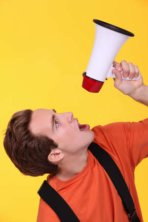 blond boy with speakerの写真素材