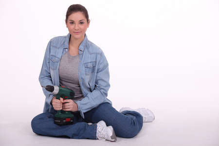 Woman with drillの写真素材