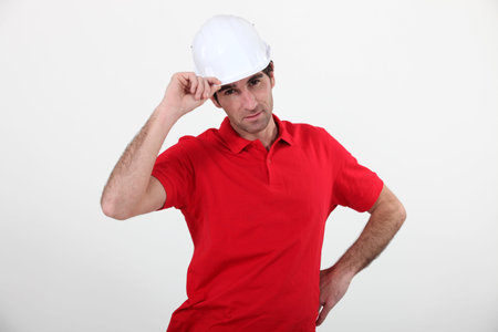 craftsman putting on his helmetの写真素材