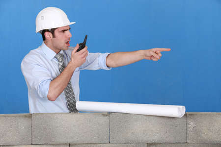 Foreman with a walkie talkieの写真素材