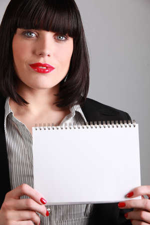 Woman with an empty notebookの写真素材