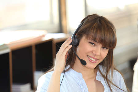 Woman with microphone and headphonesの写真素材