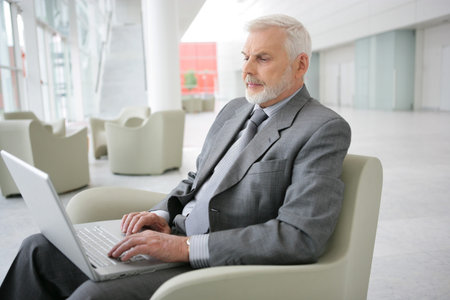 Senior businessman waiting in airport